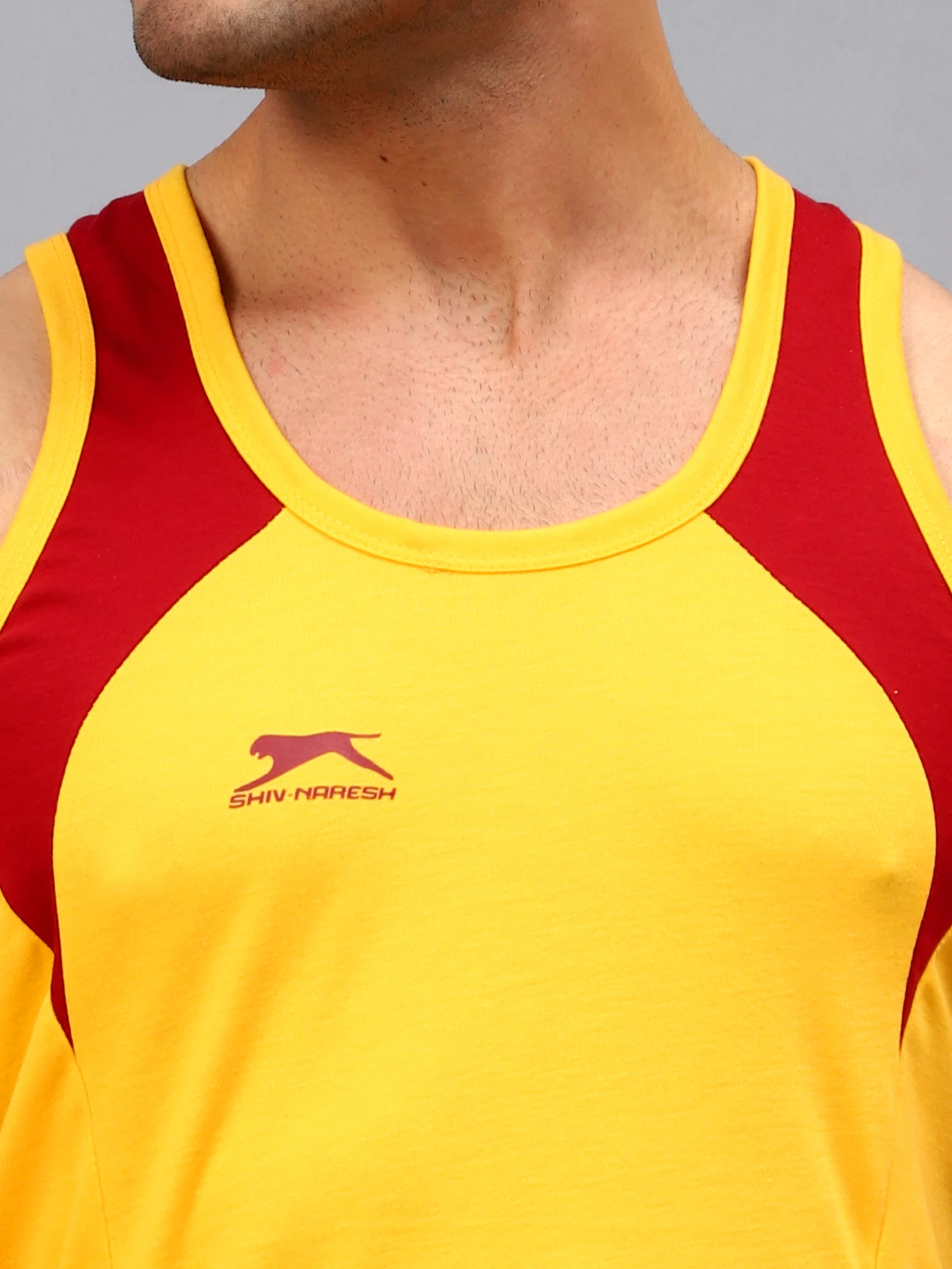 Yellow and maroon colored gym vest for men