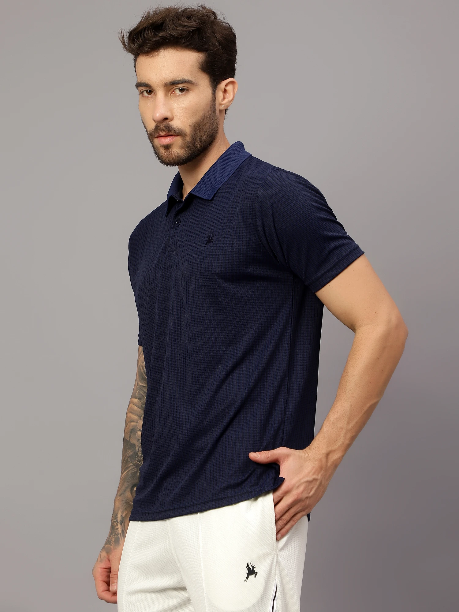 Textured Navy blue polo t shirt by Shiv Naresh