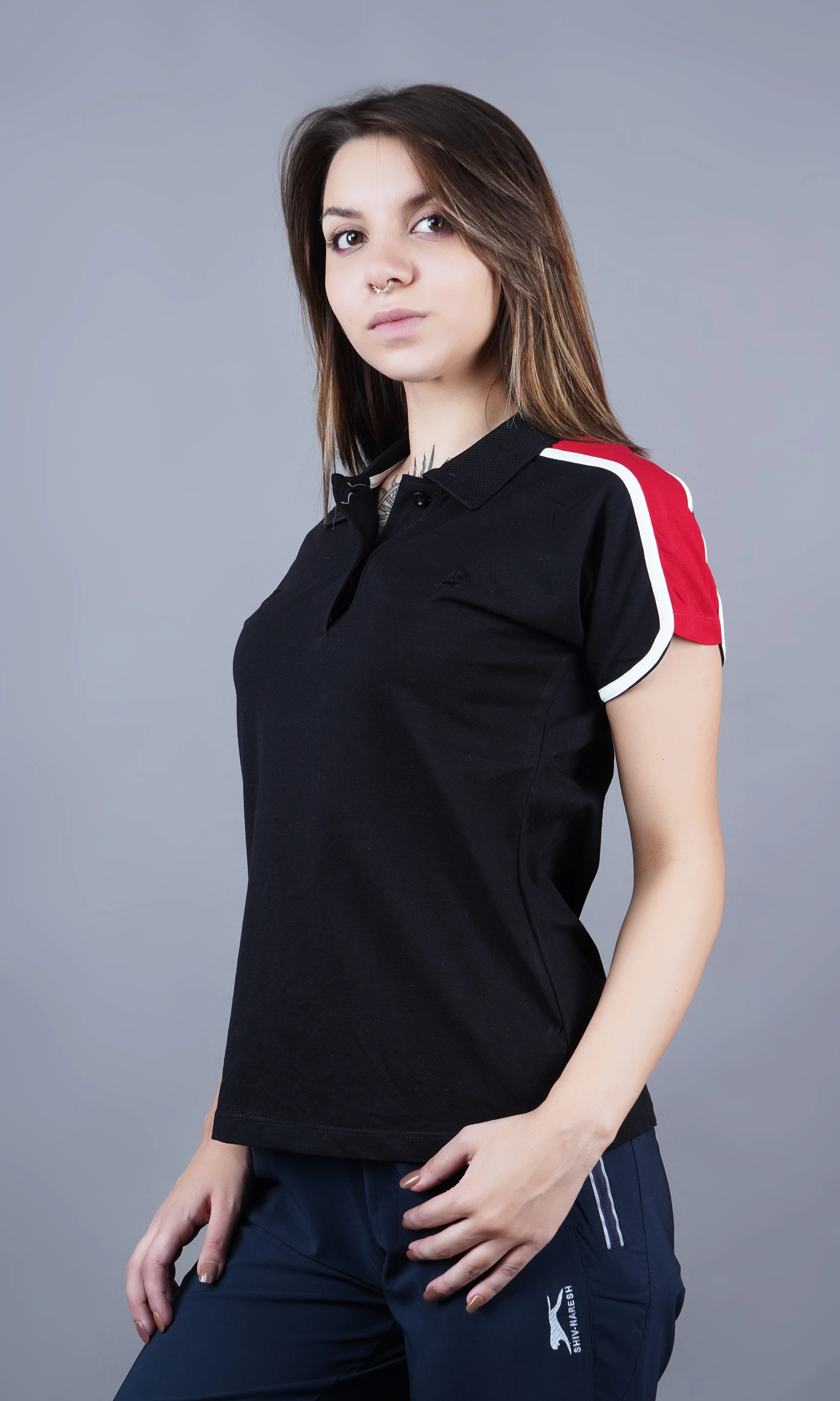 Black solid polo t-shirt for women by Shiv Naresh