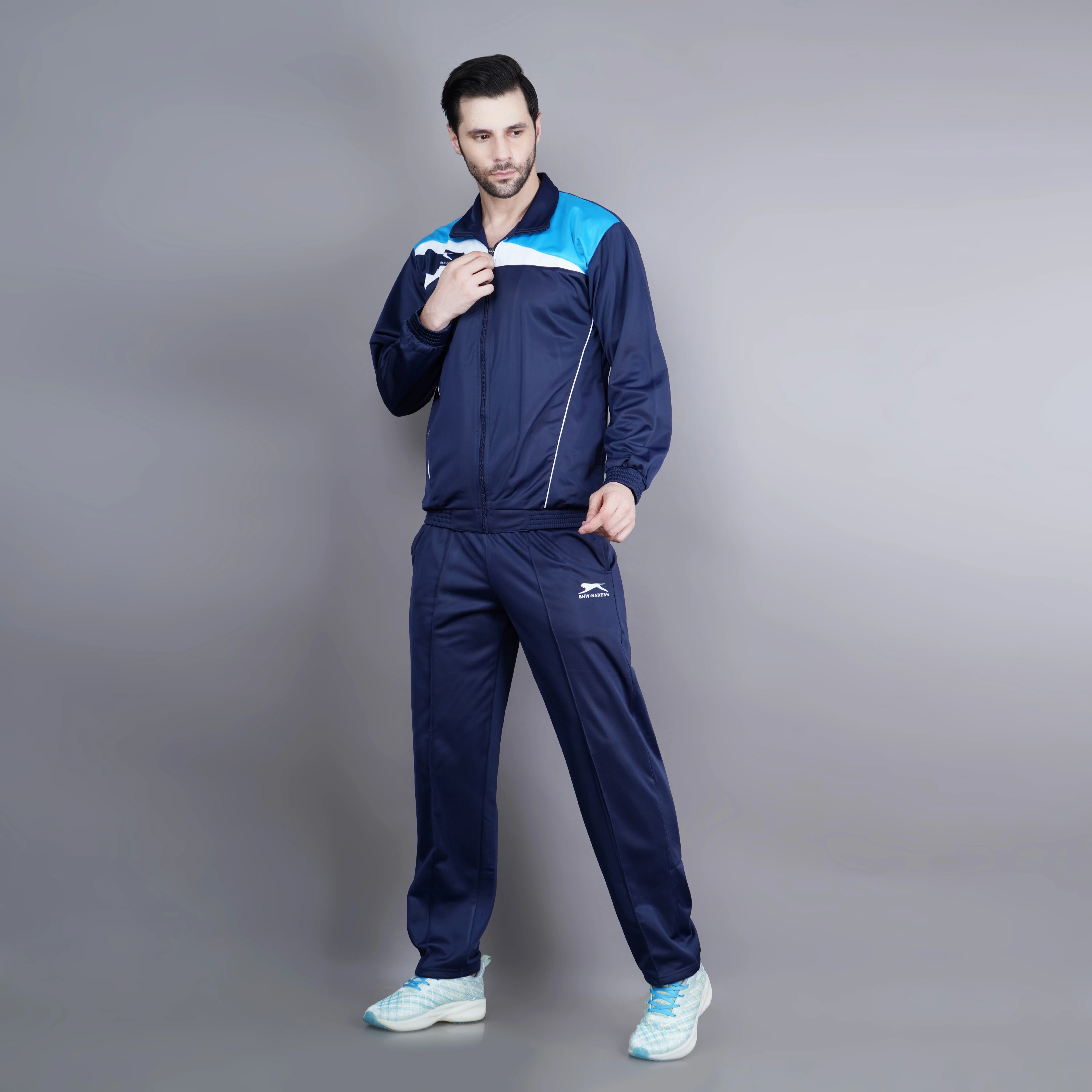 Men's navy, cyan, and white athletic tracksuit