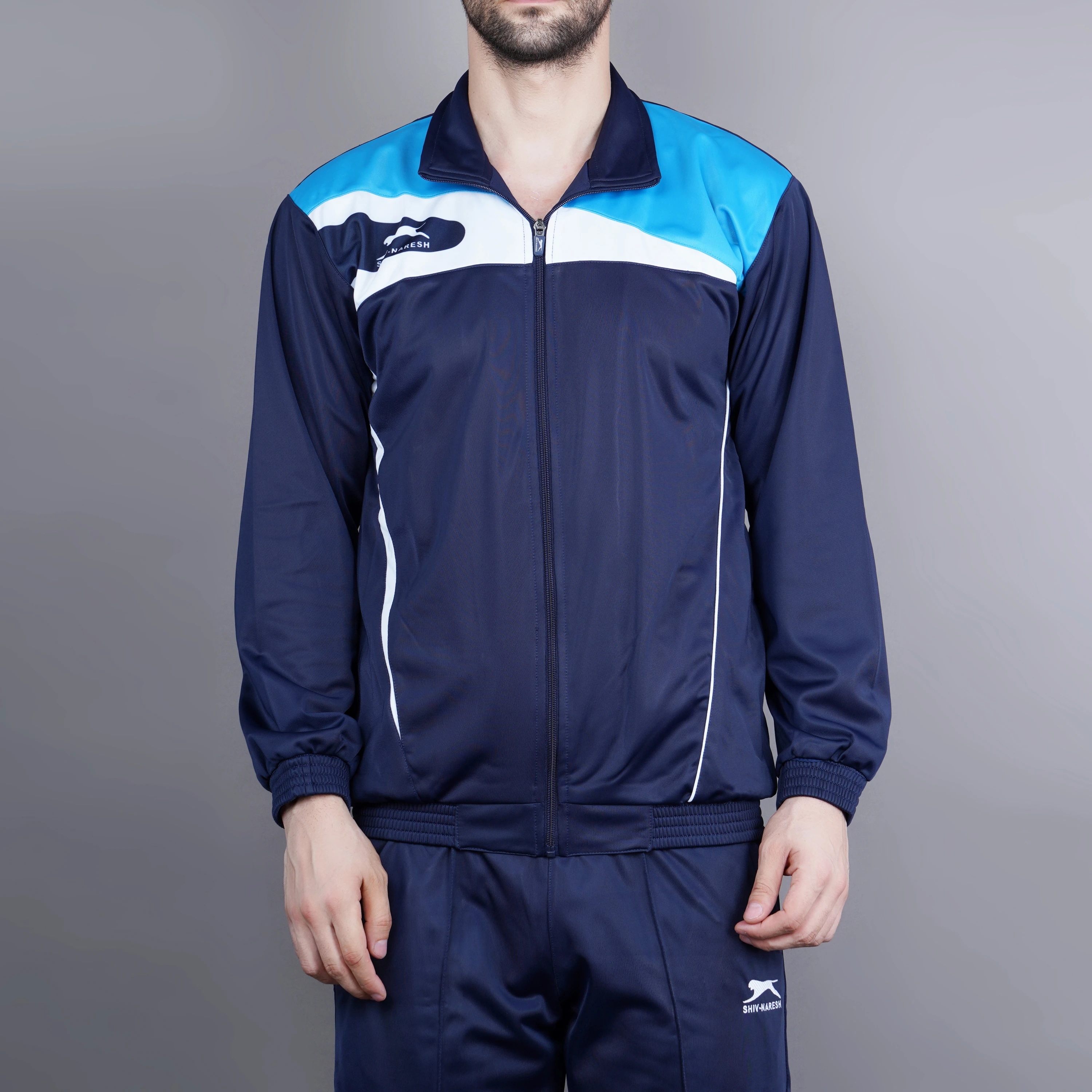 Men's navy, cyan, and white athletic tracksuit